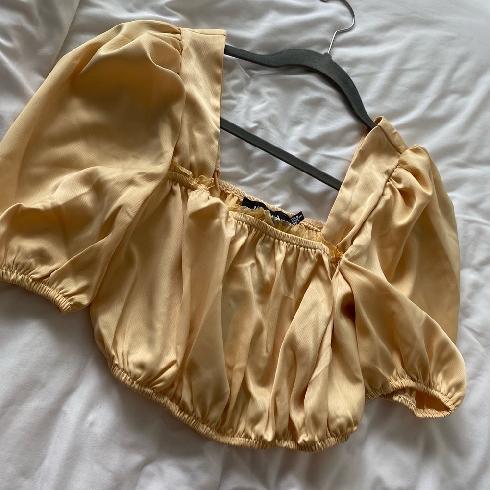Gold cropped blouse from nasty gal